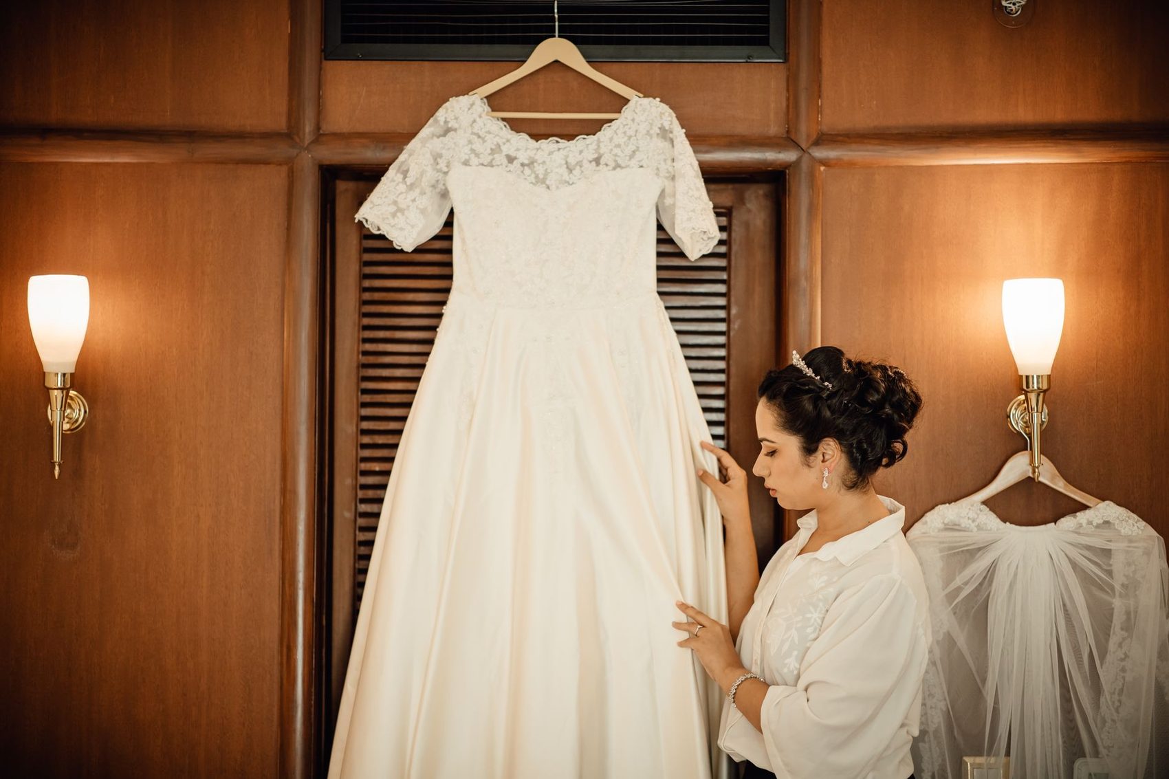 A wedding dress being prepared before the ceremony