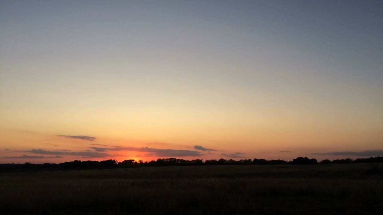 The sun setting over the Hill Country horizon